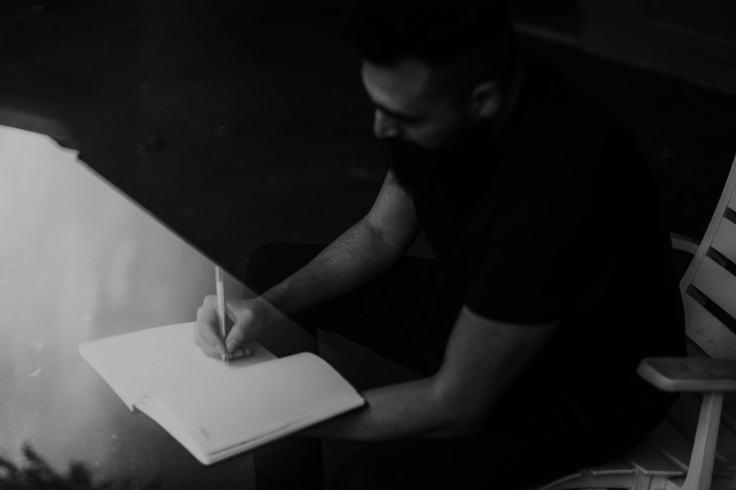 a person writing in a journal